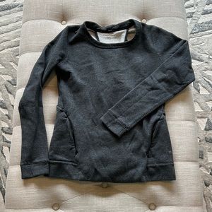 Size 2/4 ,Lululemon, grey sweatshirt, with cutouts, kangaroo pocket w/zippers.